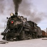 Nevada Northern Railway Locomotive No. 93 pulls a train of ore cars into the railyard