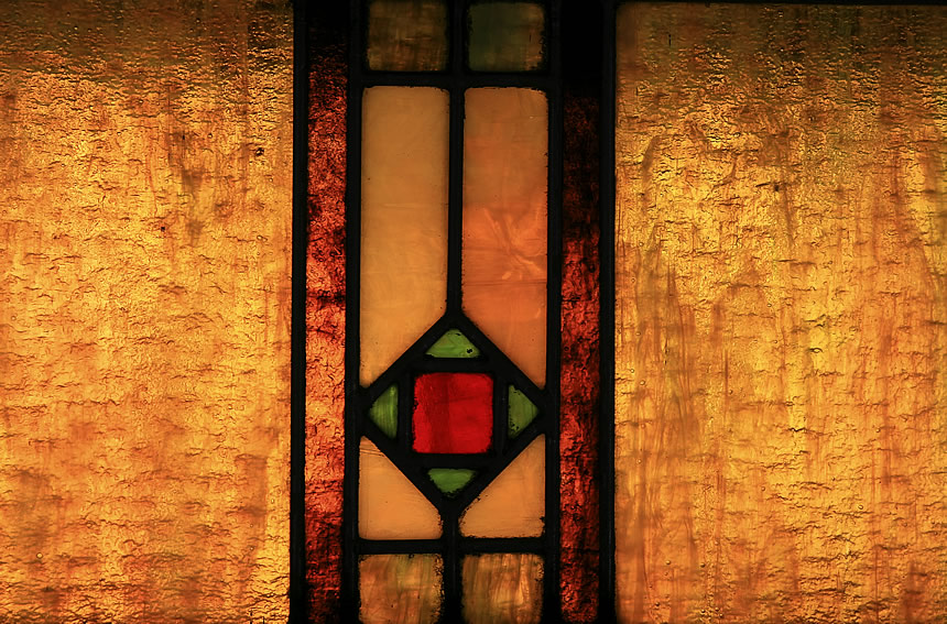 Close view of an ornamental stained glass window in Passenger Car No. 5