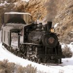 Nevada Northern Railway Locomotive No. 40 leads a passenger train out of the railroad tunnel