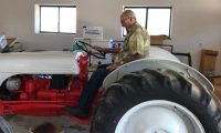 Tim Hafen sits on one of the first tractors —