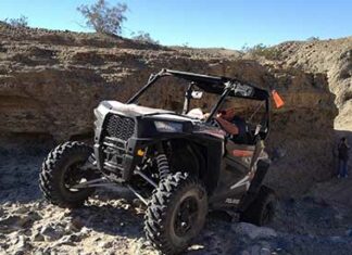 Gage Smith riding his RZR pedal to th metal