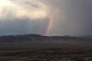 Rainbow in a rainstorm on US 95 in Nevada